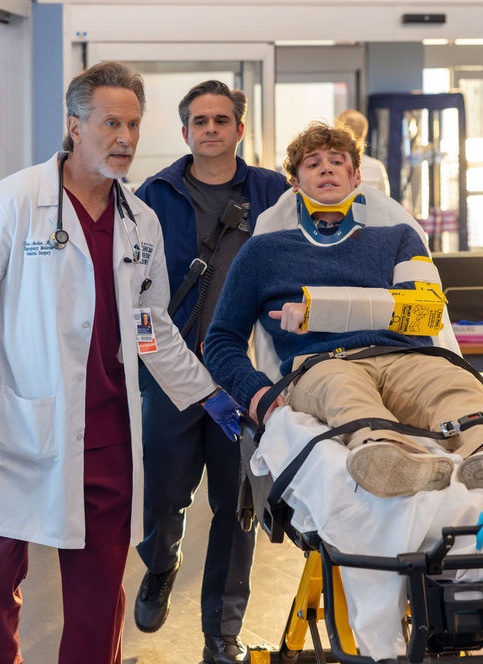 Archer walks behind an injured kid on Chicago Med Season 11 Episode 9