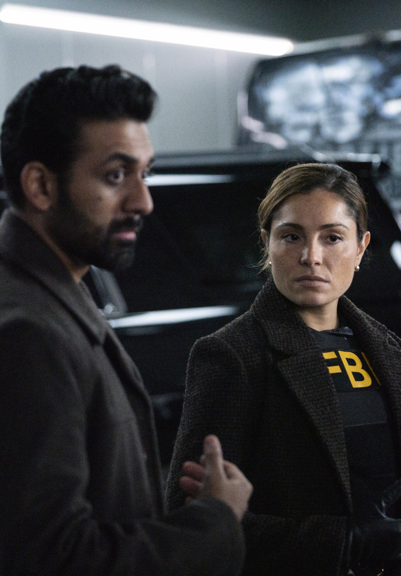 Ramos standing with some guy on FBI Season 8 Episode 12