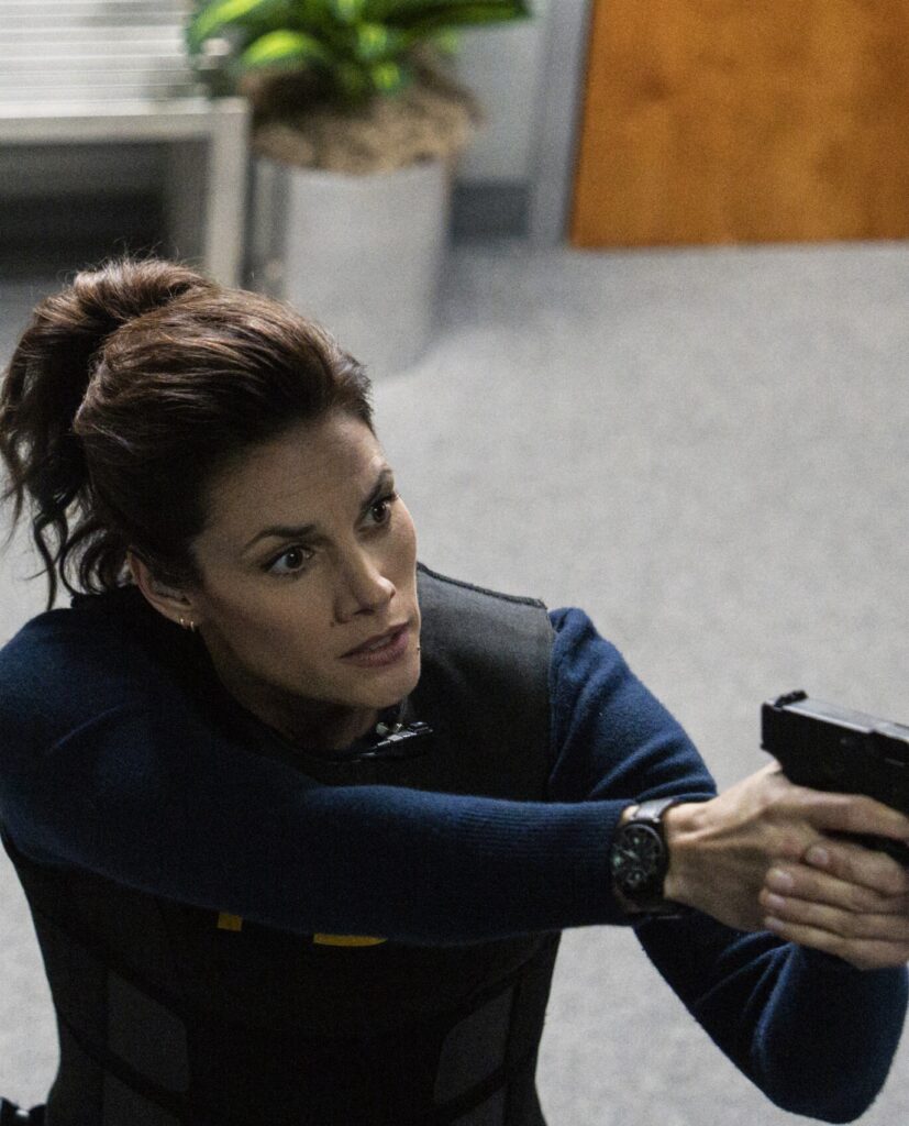 Maggie holding her gun on FBI Season 8 Episode 12