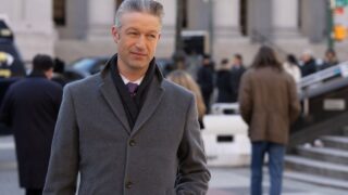 Carisi stands in front of the courthouse on Law & Order: SVU Season 27 Episode 15