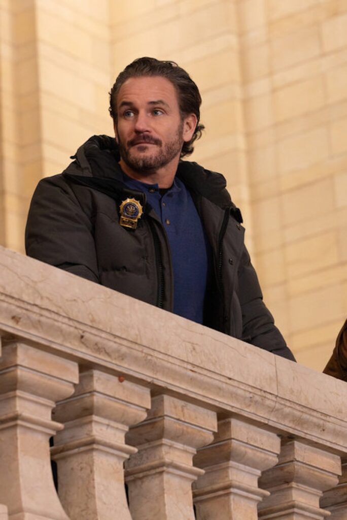 Bruno looks out over a balcony on Law & Order; SVU Season 27 Episode 14