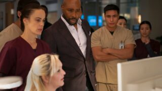 Watson studies a report on Watson Season 2 Episode 11